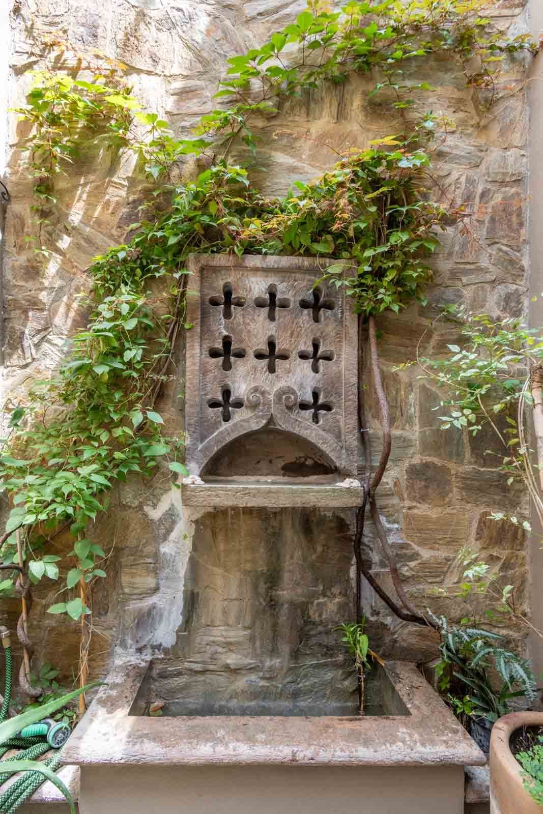 Casa de la Felicidad — San Antonio, San Miguel de Allende — photo 13 — charming stone fountain, verdant climbing vines