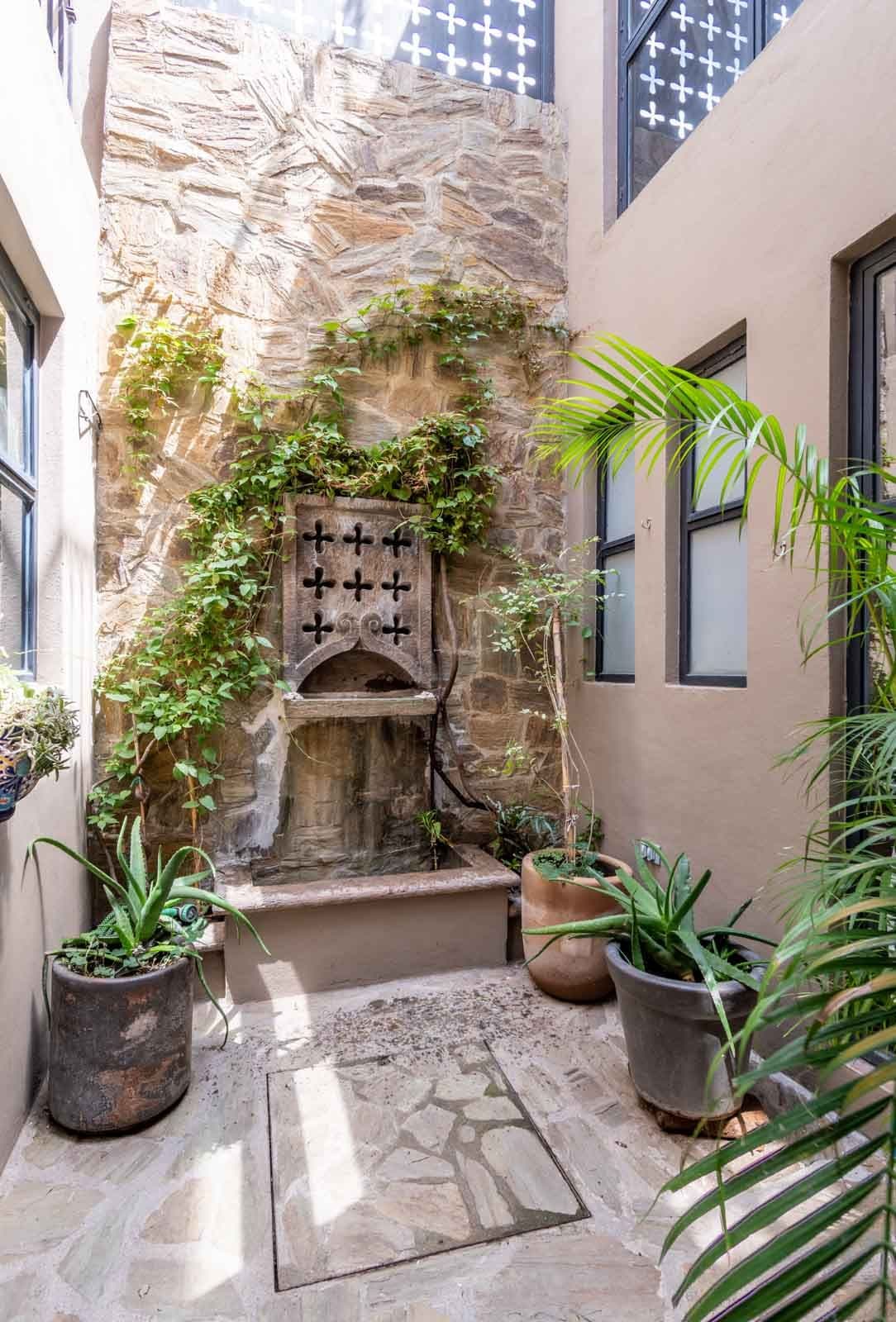 Casa de la Felicidad — San Antonio, San Miguel de Allende — photo 12 — charming courtyard with historic stone details