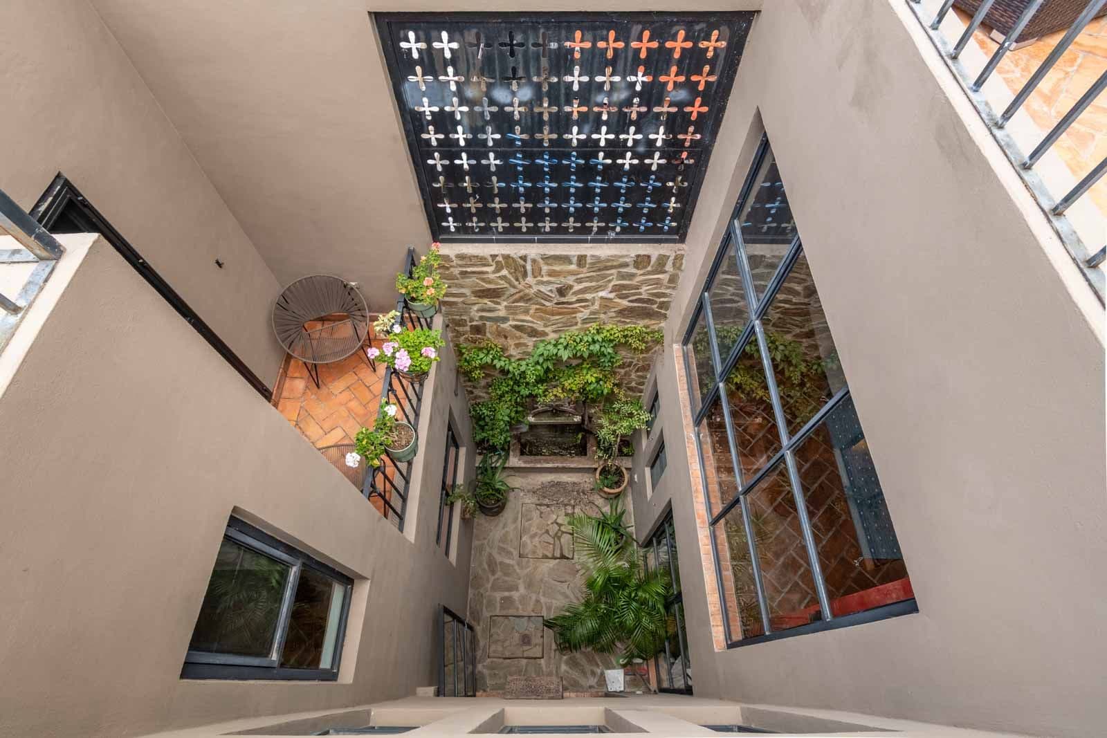 Casa de la Felicidad — San Antonio, San Miguel de Allende — photo 23 — serene courtyard bathed in natural light