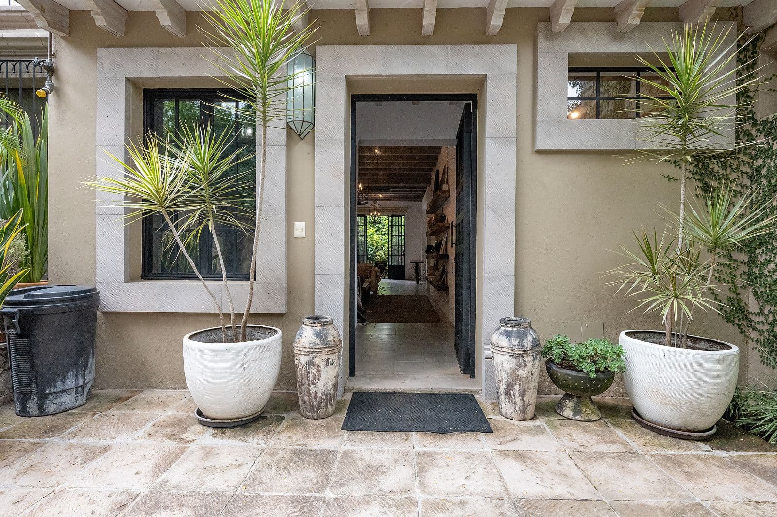 Casa Fia — Centro, San Miguel de Allende — photo 3 — welcoming courtyard entry, curated botanical charm