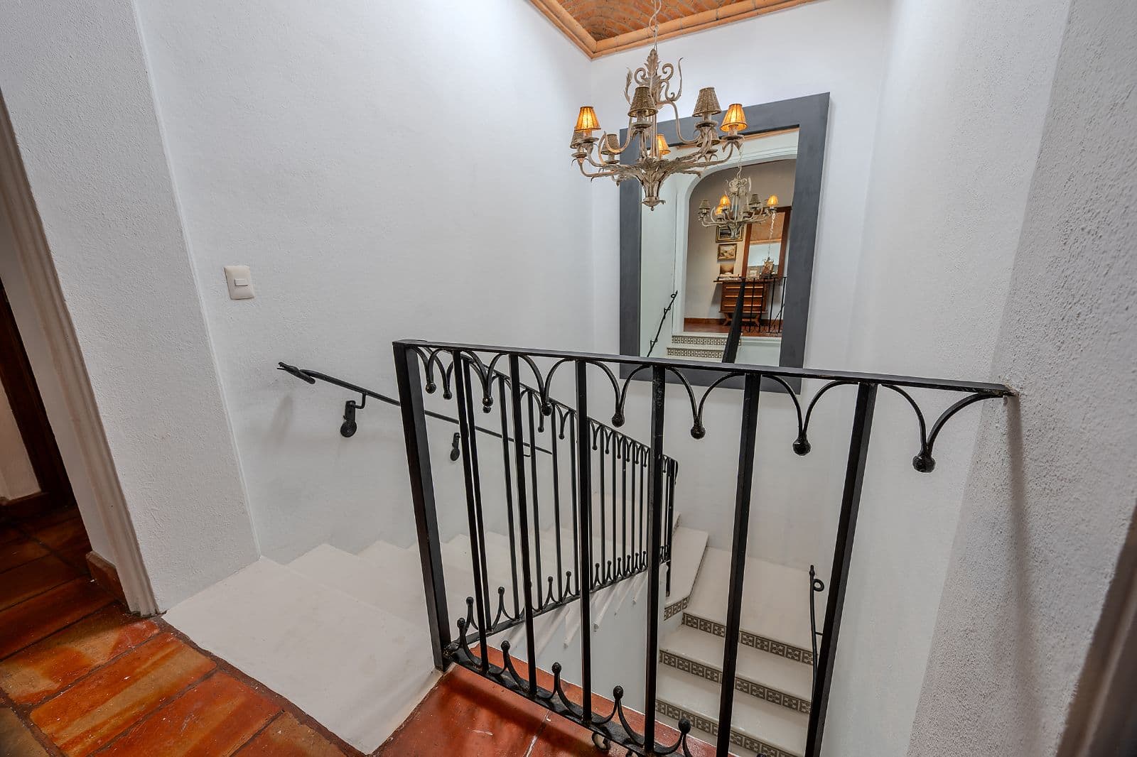 Casa Fia — Centro, San Miguel de Allende — photo 23 — elegant staircase, ornate brass fixtures