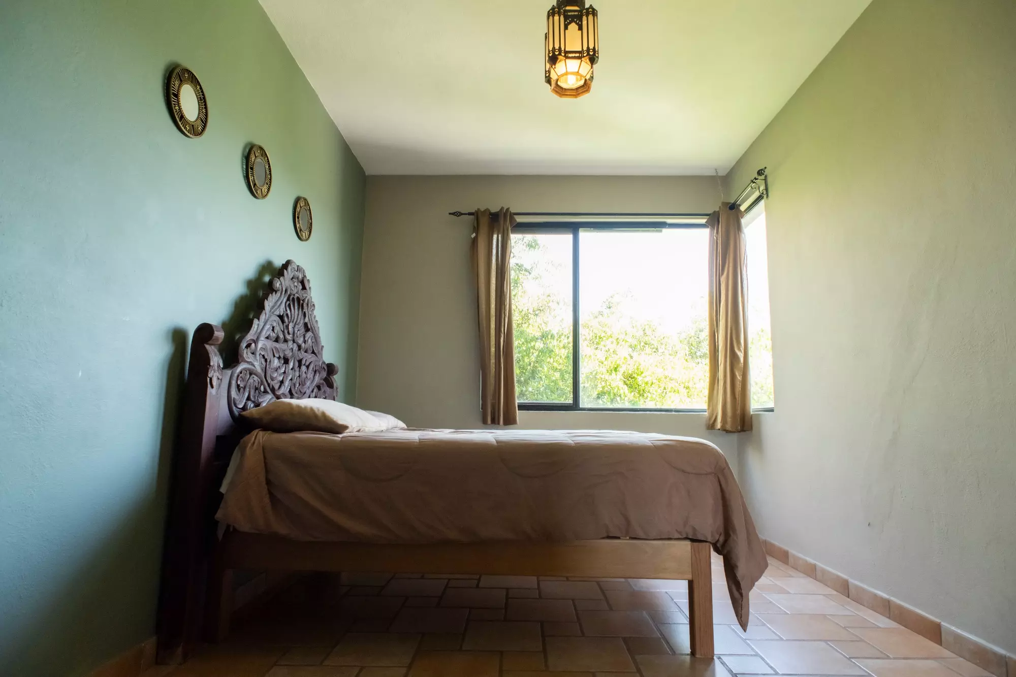 CASA LINDA — Lindavista, San Miguel de Allende — photo 8 — serene bedroom with verdant views