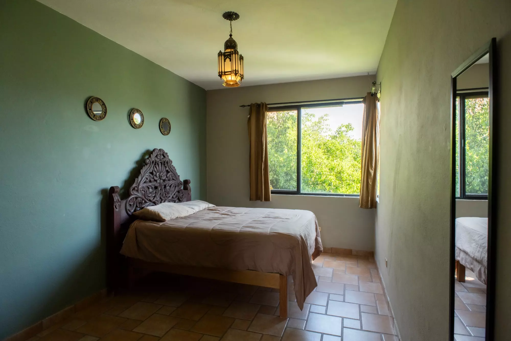 CASA LINDA — Lindavista, San Miguel de Allende — photo 10 — serene bedroom with verdant views