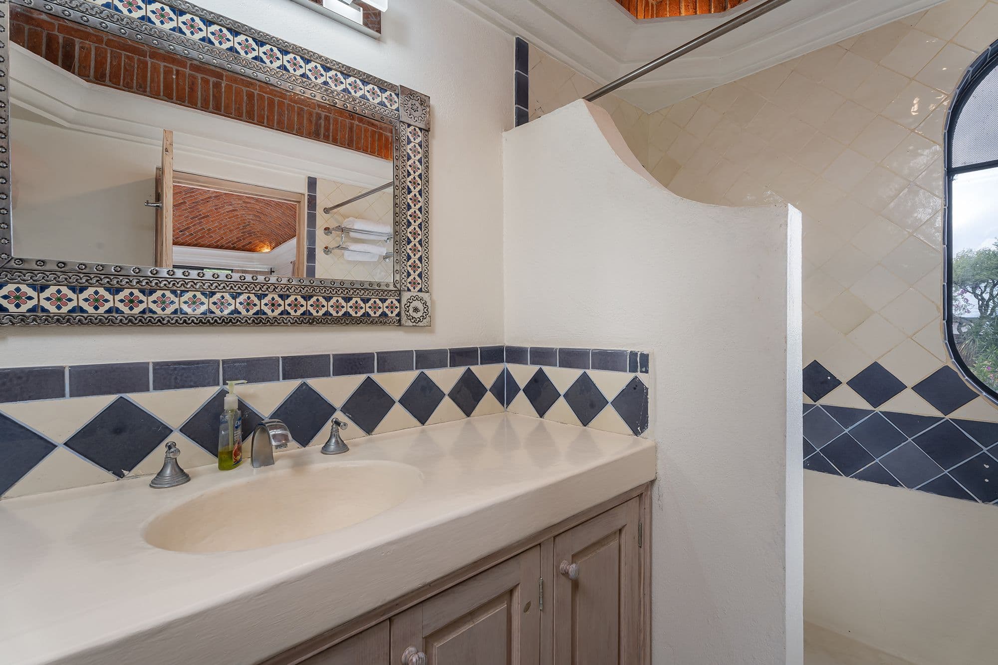 Casa Esplendida — Ojo de Agua, San Miguel de Allende — photo 22 — artisan-tiled spa bathroom with elegant details