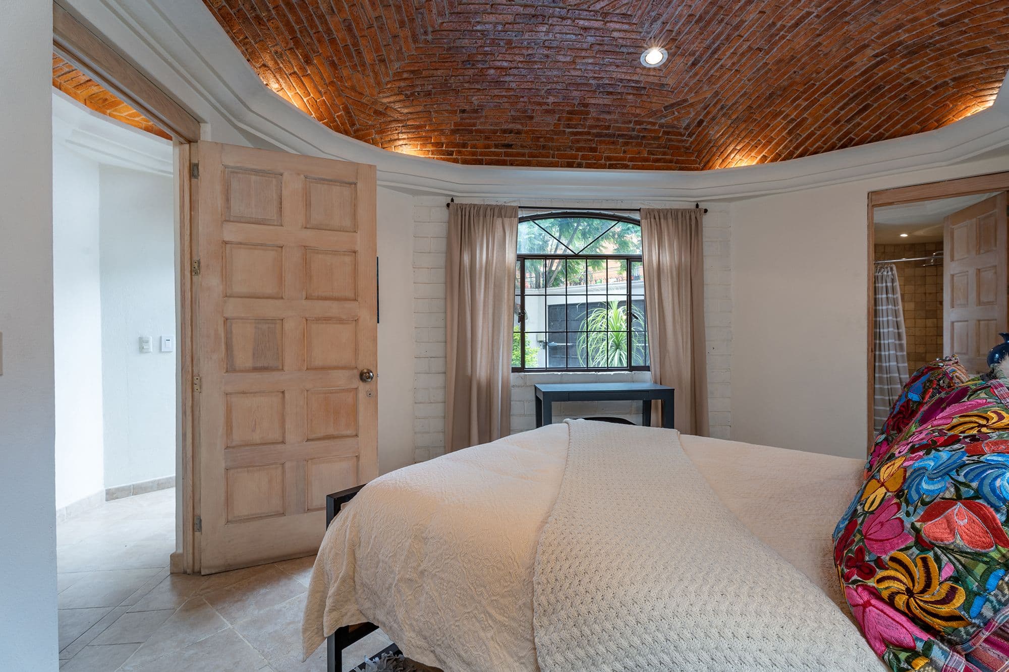 Casa Esplendida — Ojo de Agua, San Miguel de Allende — photo 16 — rustic-elegant master suite, soaring brick ceilings