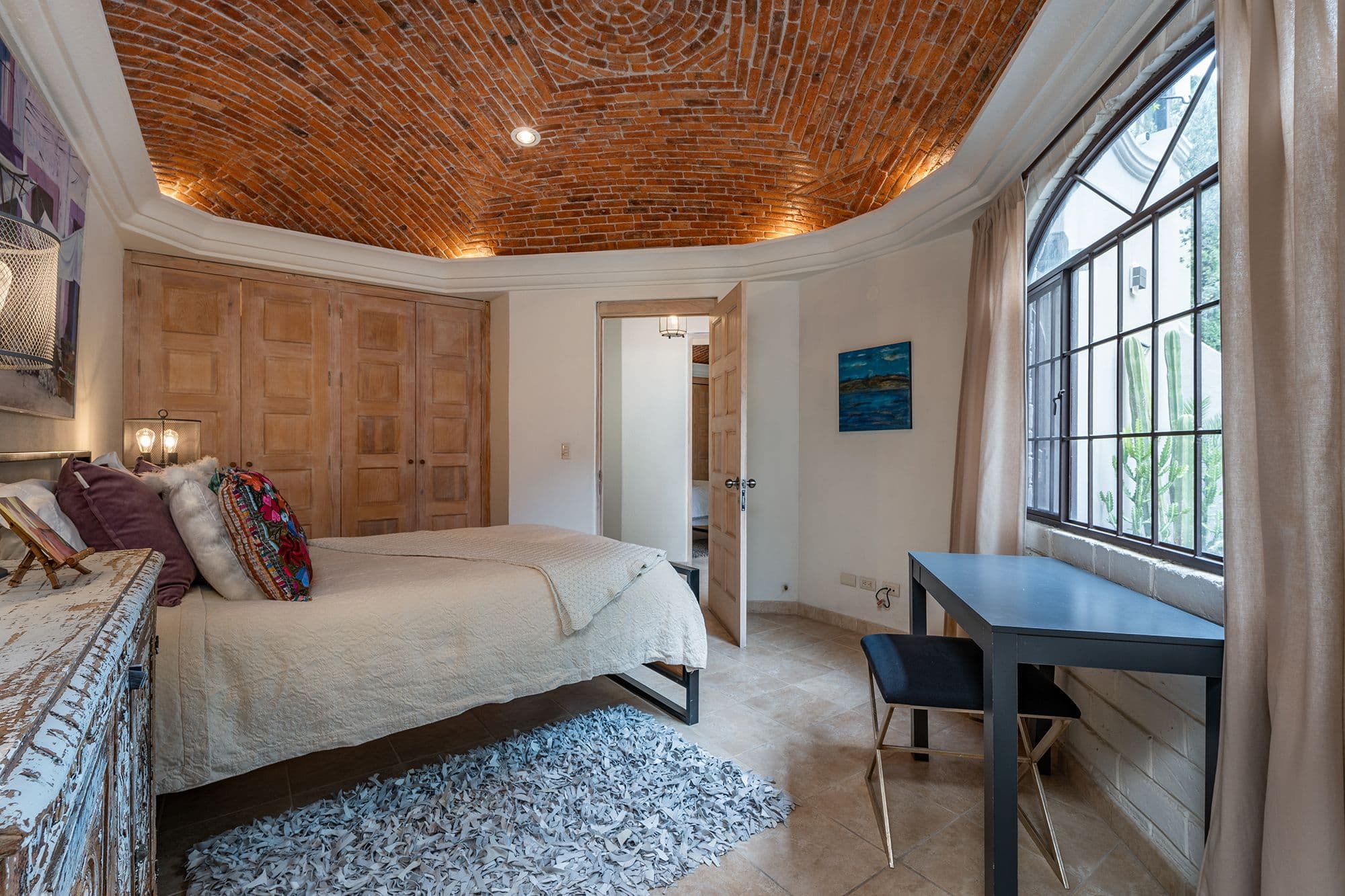 Casa Esplendida — Ojo de Agua, San Miguel de Allende — photo 14 — sophisticated master suite, soaring brick ceiling