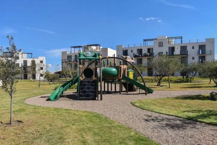 Villa Mila — La Luminaria, San Miguel de Allende — photo 18 — contemporary community playground, verdant landscaping