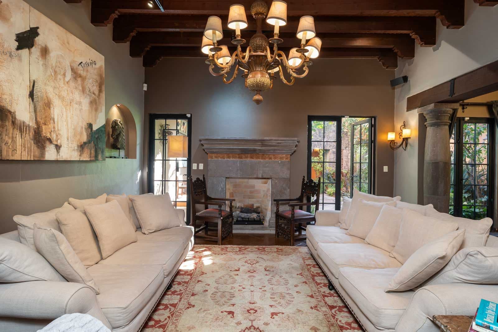 Casa Bella Vita — Centro, San Miguel de Allende — photo 2 — elegant living room, fireplace, natural light