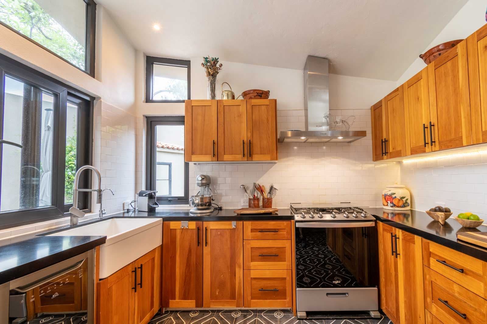 Casa Vista del Cielo — Atascadero (Arcos de San Miguel), San Miguel de Allende — photo 4 — warm wood cabinetry, sophisticated culinary space