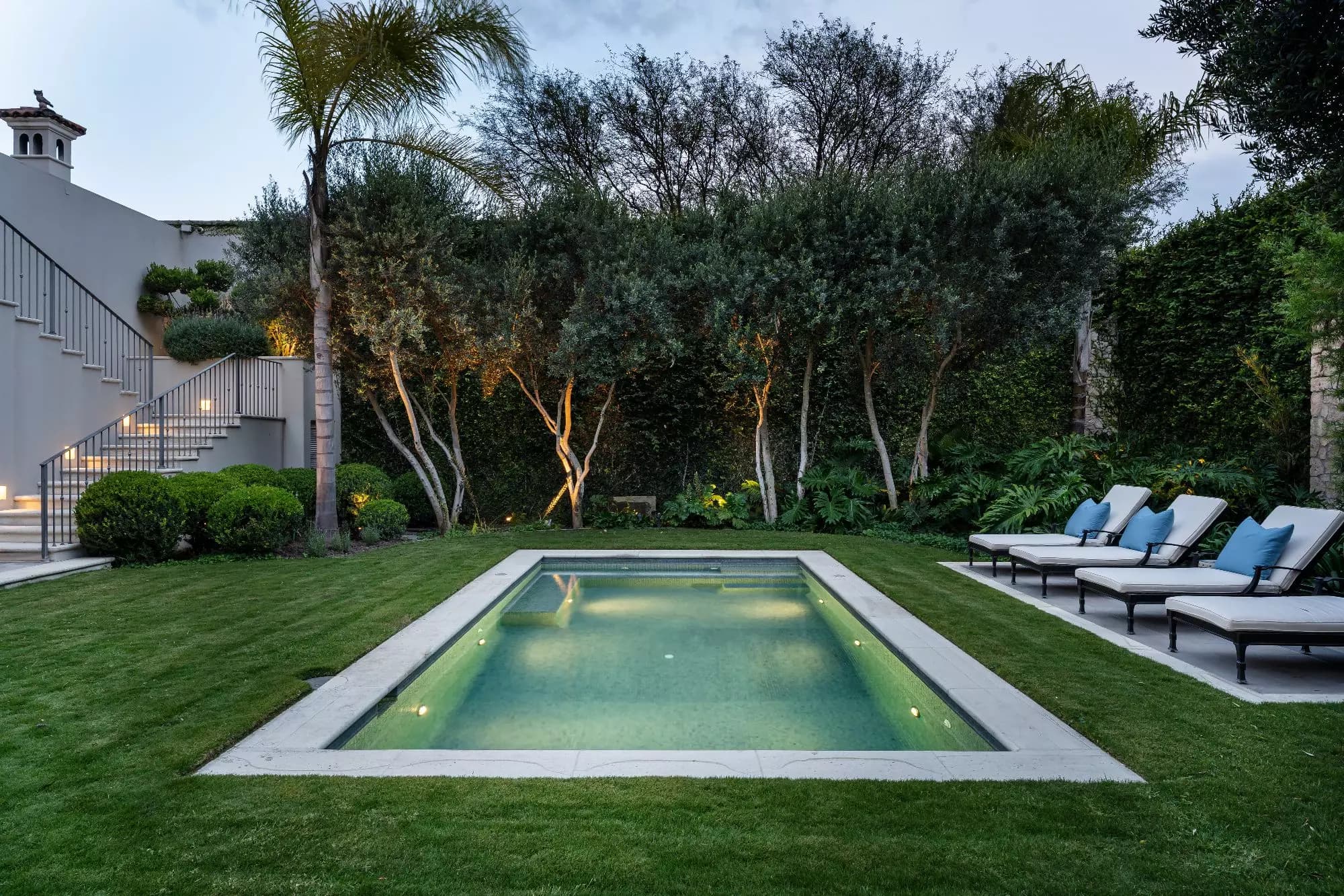 Casa Sienna — Atascadero (Arcos de San Miguel), San Miguel de Allende — photo 18 — serene lap pool, manicured gardens, twilight ambiance