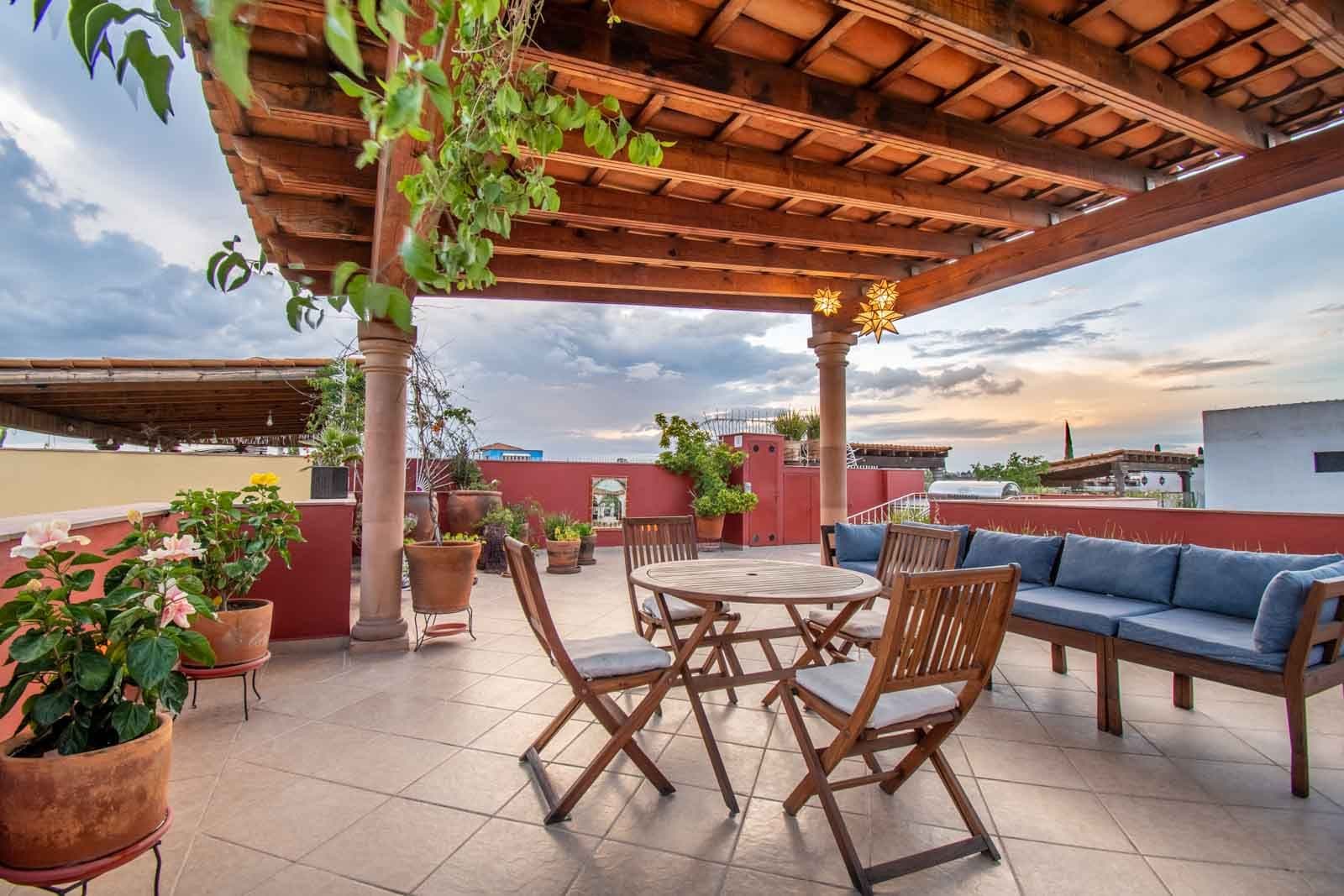 CASA ARCO de LUZ — Guadalupe, San Miguel de Allende — photo 23 — expansive rooftop terrace, stunning sunset views