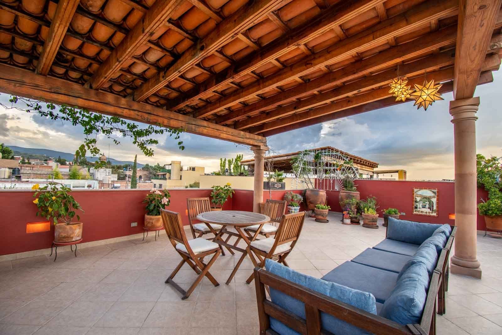 CASA ARCO de LUZ — Guadalupe, San Miguel de Allende — photo 22 — expansive rooftop terrace, mountain views