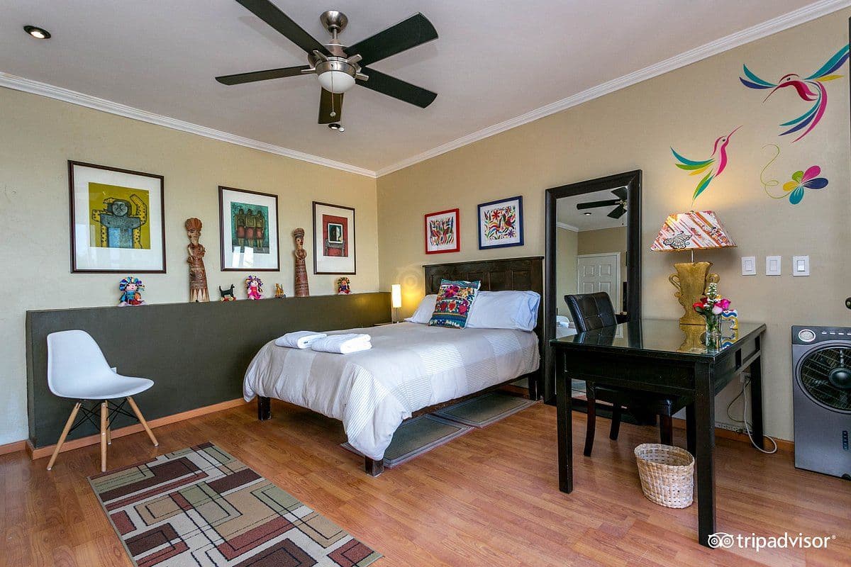 CASA CINCO PATIOS CENTRO β Centro, San Miguel de Allende β photo 6 β vibrant, artfully curated bedroom sanctuary