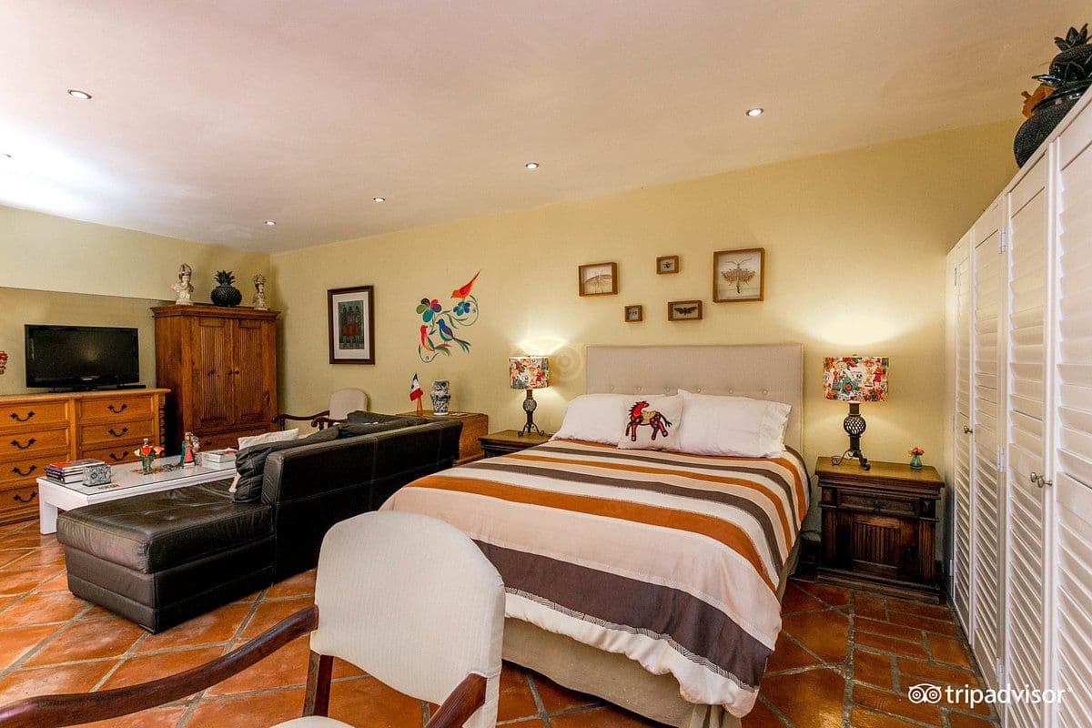CASA CINCO PATIOS CENTRO β Centro, San Miguel de Allende β photo 16 β sunlit master suite with mexican charm