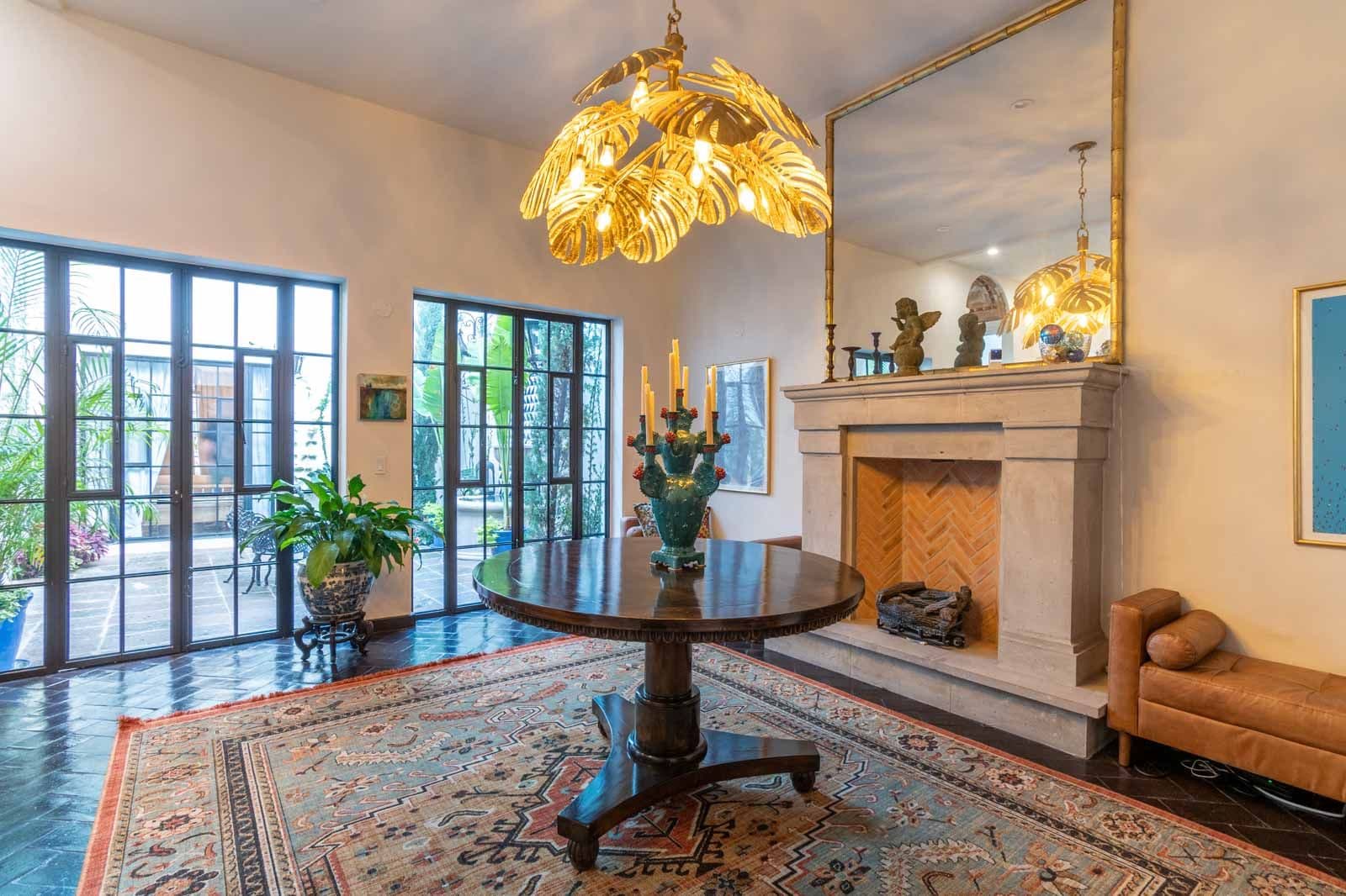 Casa Jacaranda — Guadiana, San Miguel de Allende — photo 3 — elegant foyer with golden sculptural lighting