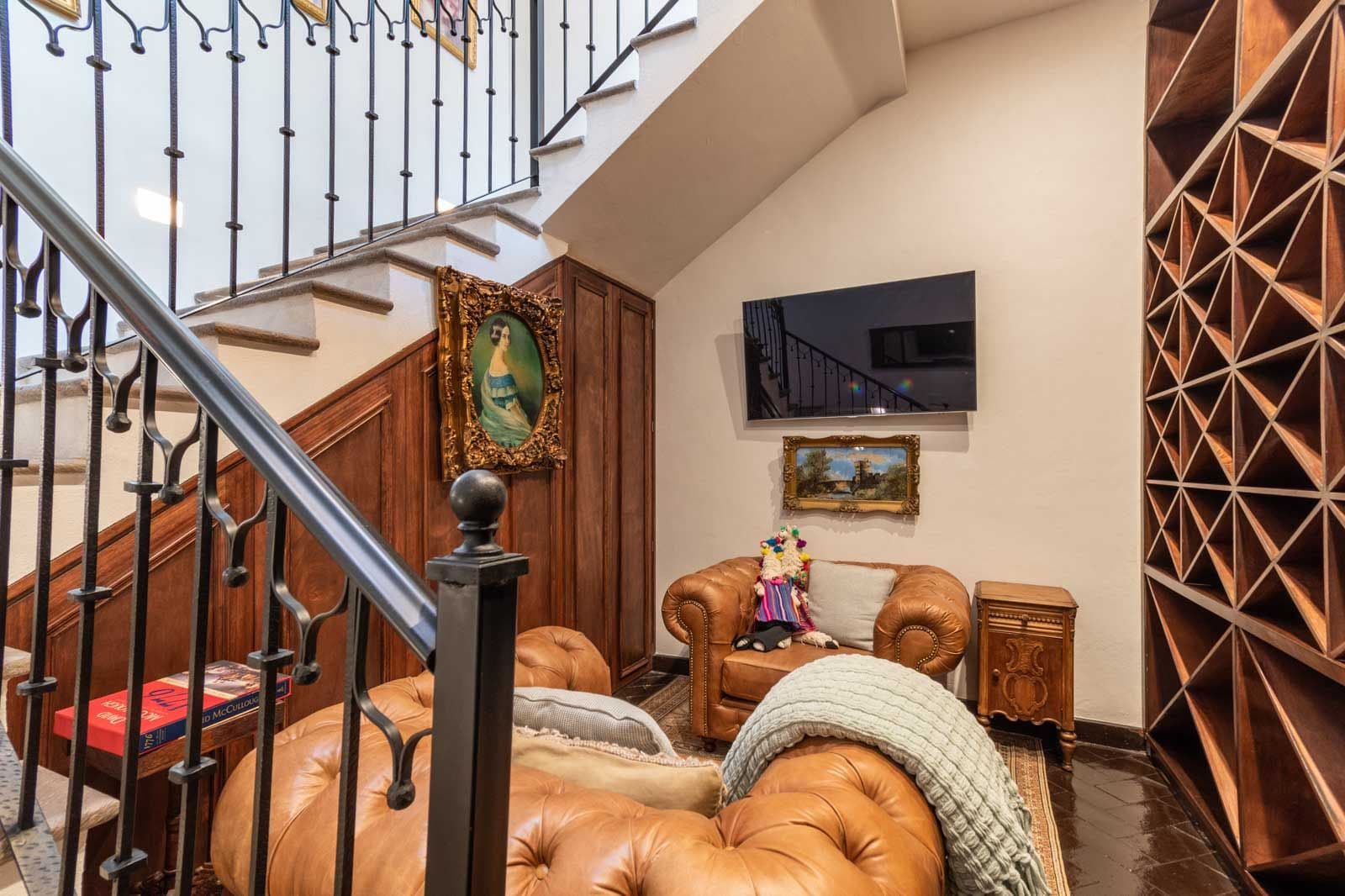 Casa Jacaranda — Guadiana, San Miguel de Allende — photo 5 — elegant mezzanine lounge, curated art collection