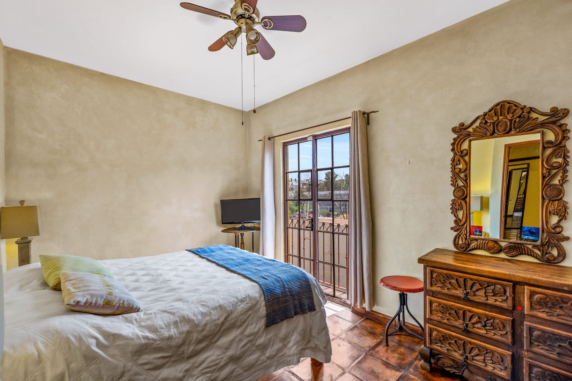 Casa de las Nubes — San Antonio, San Miguel de Allende — photo 10 — sunlit bedroom with colonial charm
