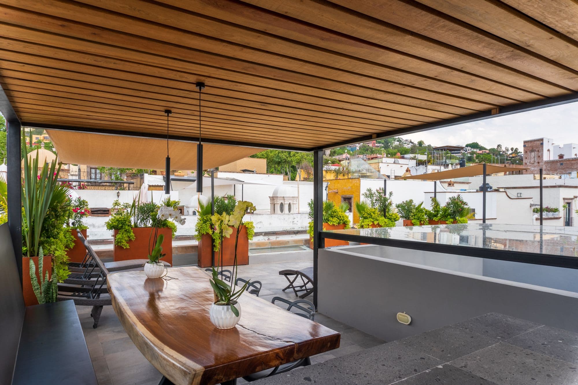 CASA XANTHE — Centro, San Miguel de Allende — photo 23 — sophisticated rooftop entertaining space overlooking charming colonial architecture