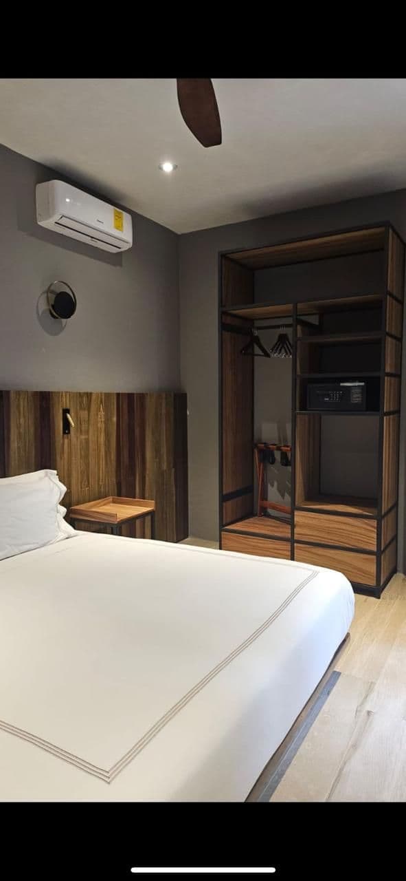 RECREO 15 — Centro, San Miguel de Allende — photo 14 — contemporary bedroom with walk-in wardrobe