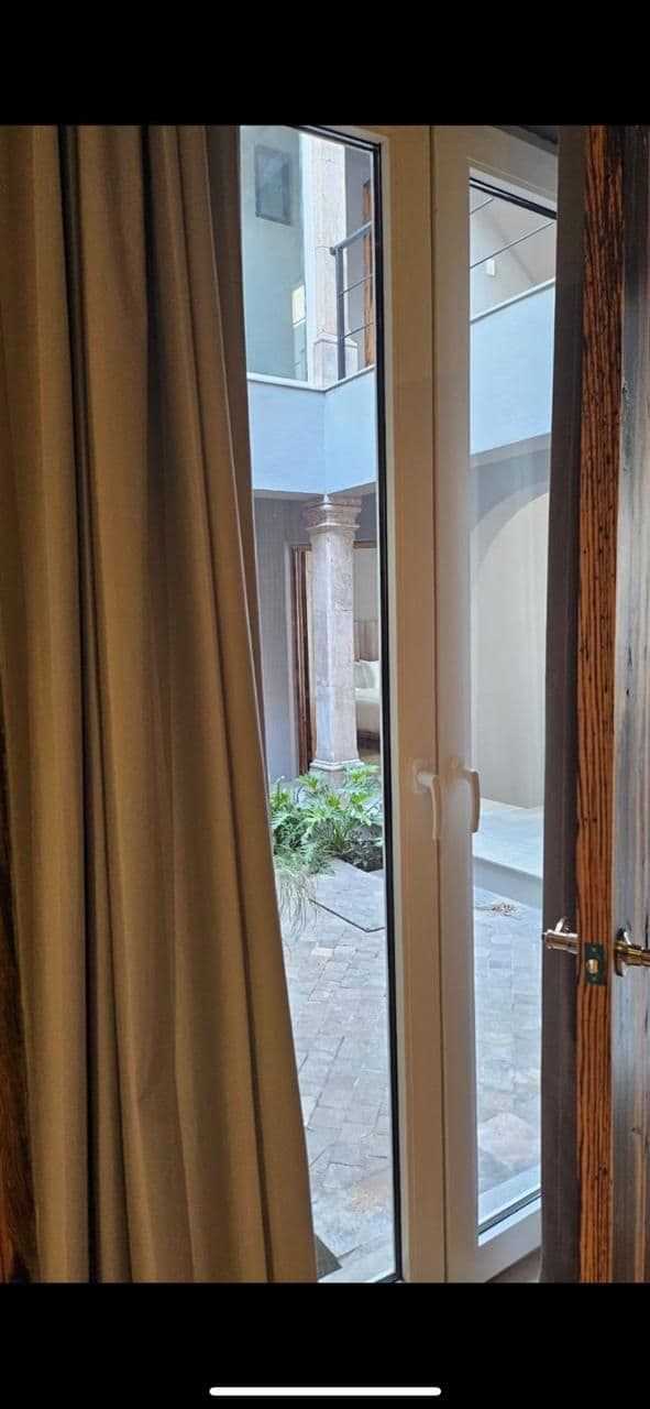 RECREO 15 — Centro, San Miguel de Allende — photo 9 — serene courtyard view, elegant interior passage