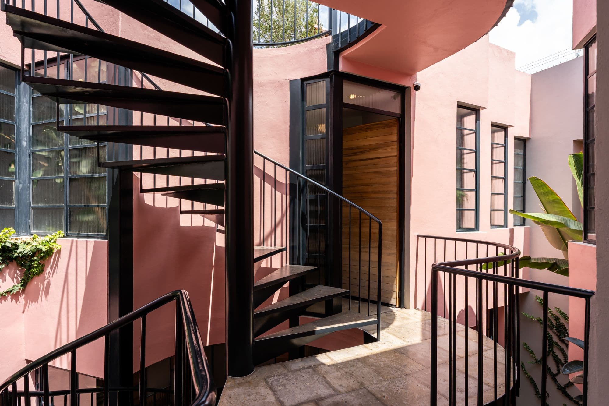 The Brooklane — Centro, San Miguel de Allende — photo 27 — elegant courtyard, dramatic light, architectural curves