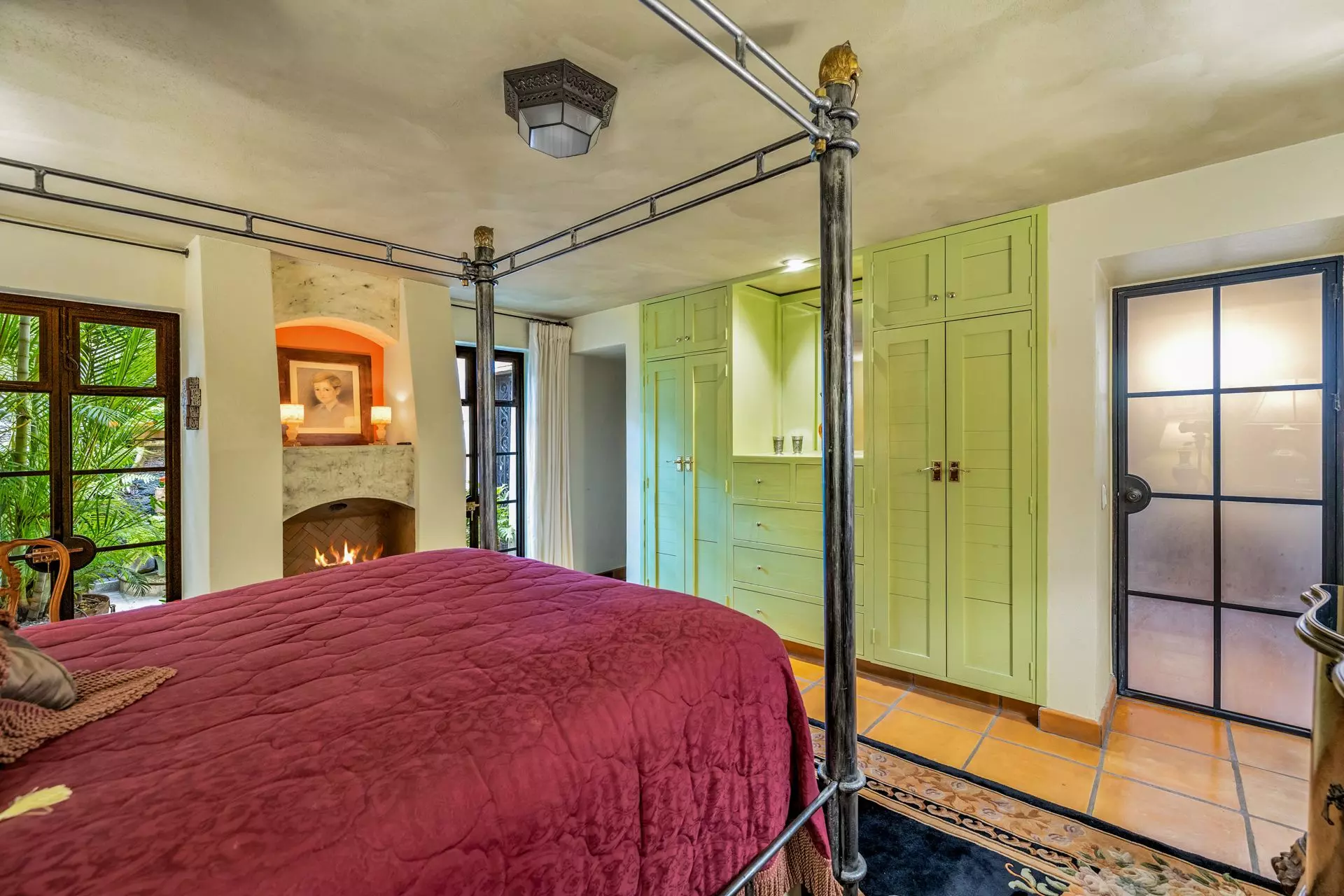 Casa Flora — Guadiana, San Miguel de Allende — photo 29 — elegant master suite with fireplace charm