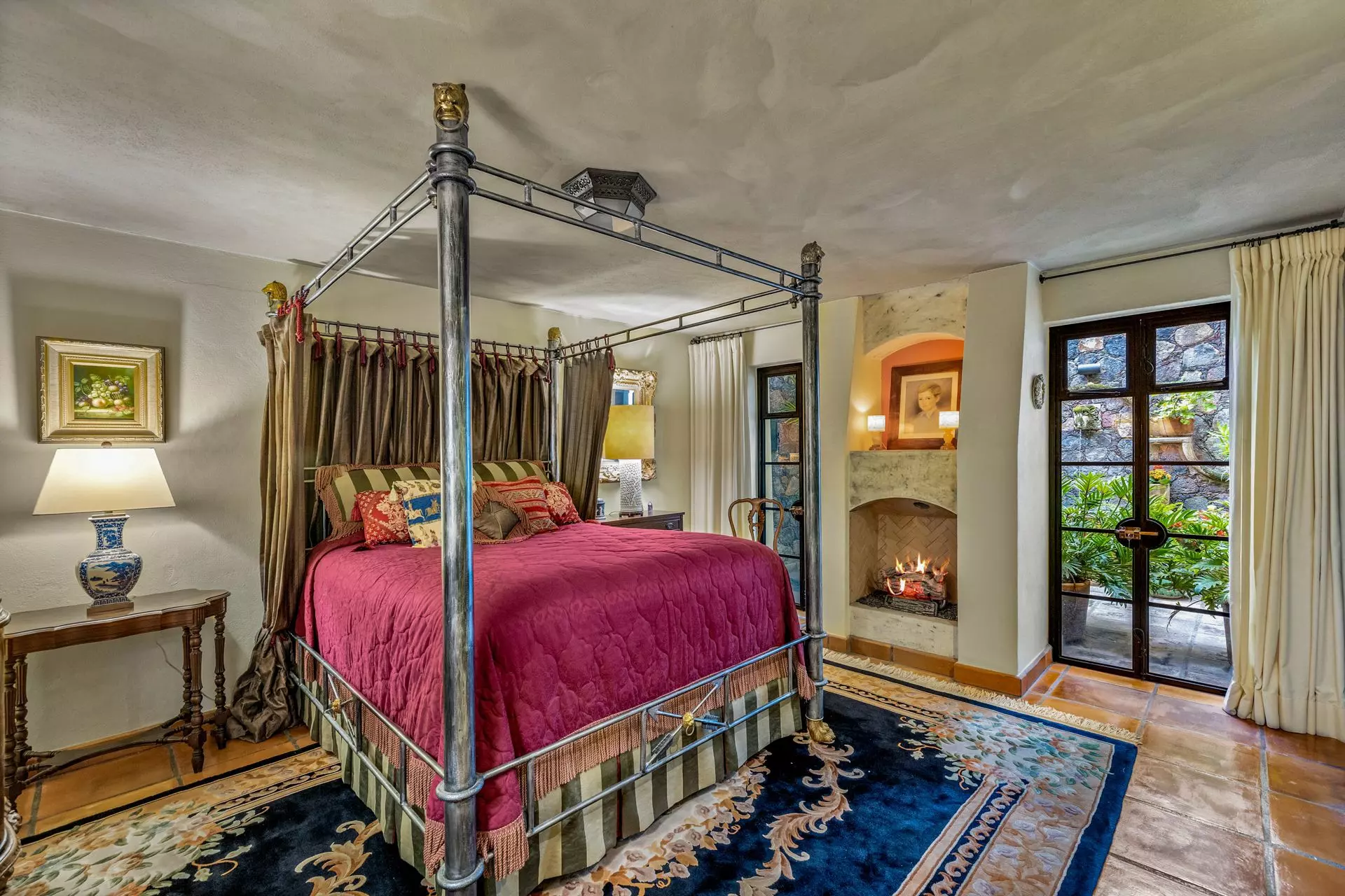 Casa Flora — Guadiana, San Miguel de Allende — photo 27 — luxurious canopy bed, fireplace sanctuary