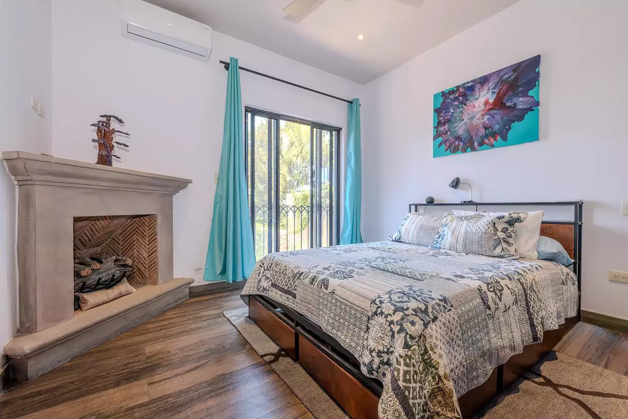 Casa Bella-Vista — Caracol, San Miguel de Allende — photo 10 — serene master suite, fireplace, garden views