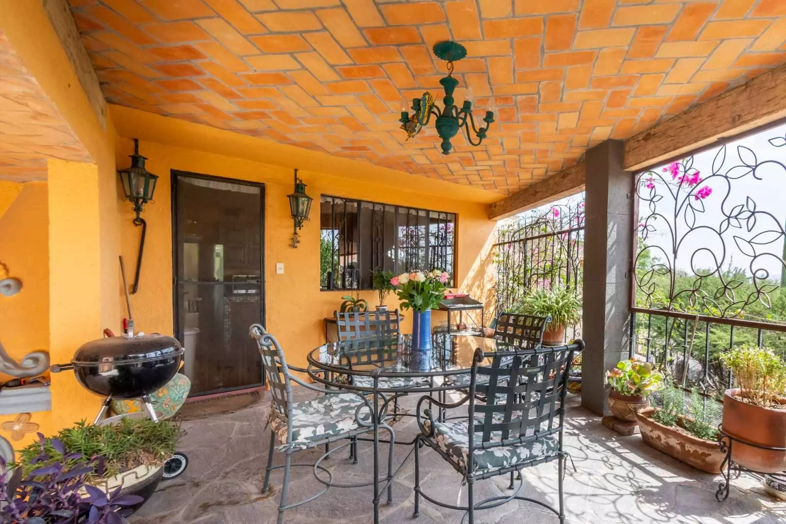 Casa Mirador del Sol — Ojo de Agua, San Miguel de Allende — photo 11 — charming terracotta terrace with vibrant character