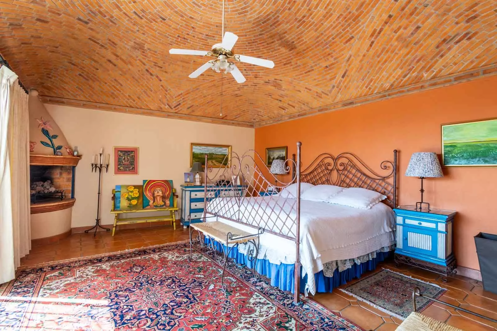 Casa Mirador del Sol — Ojo de Agua, San Miguel de Allende — photo 15 — vibrant master suite, rustic beamed elegance