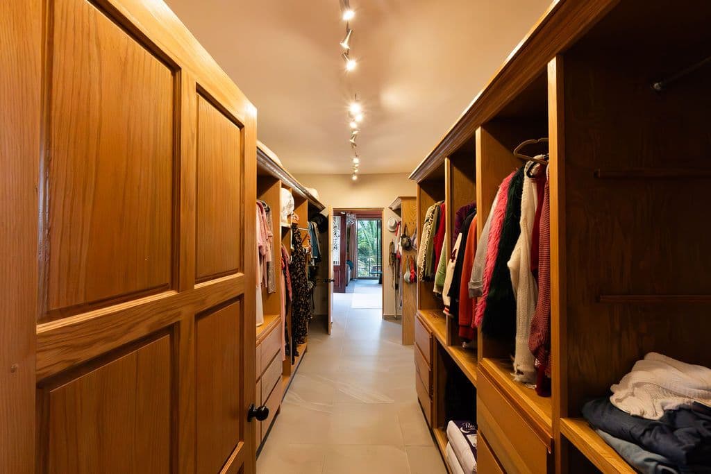 Casa Arcoiris en Rancho Los Labradores — Los Labradores, San Miguel de Allende — photo 18 — luxurious walk-in closet, elegant wood cabinetry
