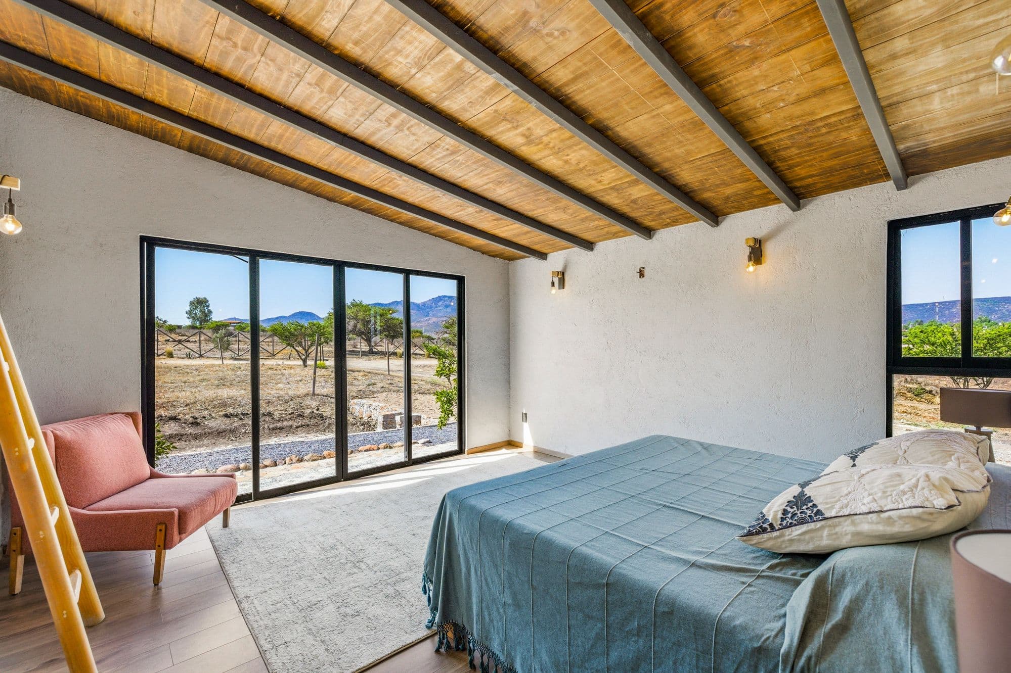 Casa Pavo Real — Sosnabar, San Miguel de Allende — photo 13 — luminous bedroom with vineyard views