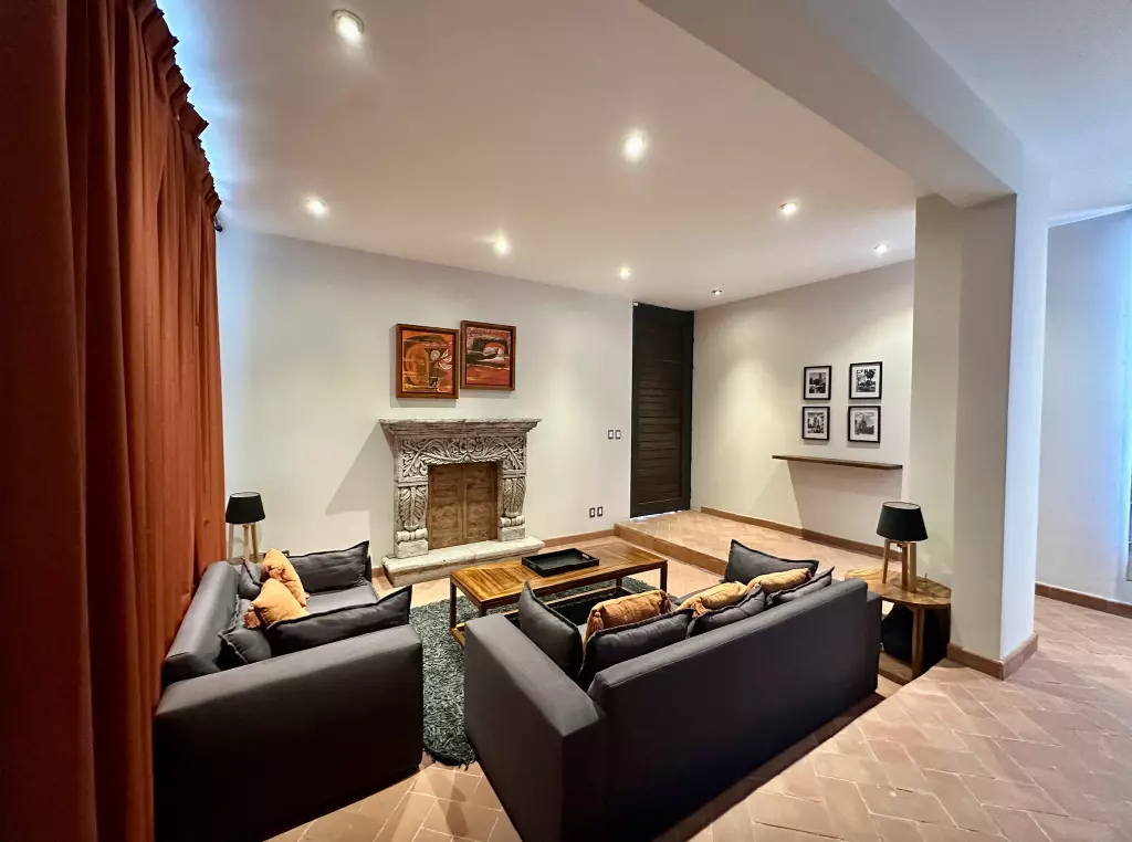 Casa Paraiso Arcangeles — El Paraiso, San Miguel de Allende — photo 8 — sophisticated entertaining space, ornate fireplace