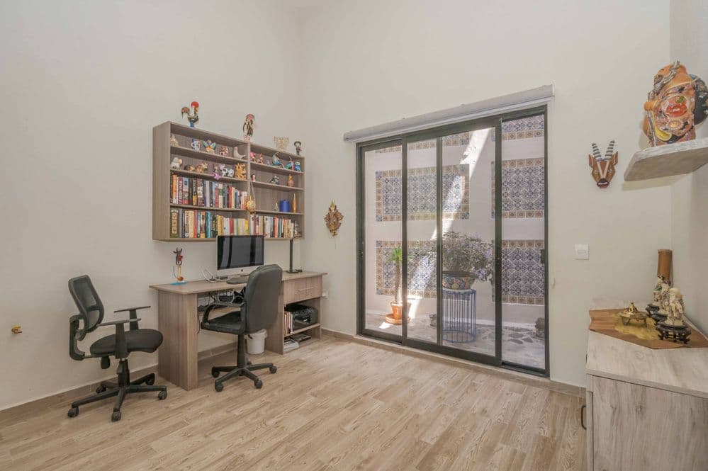 Casa Huerta La Antigua — Antigua Residencial, San Miguel de Allende — photo 43 — sunlit home office with courtyard views