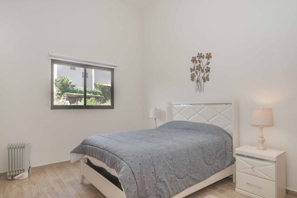 Casa Huerta La Antigua — Antigua Residencial, San Miguel de Allende — photo 3 — serene bedroom with garden views