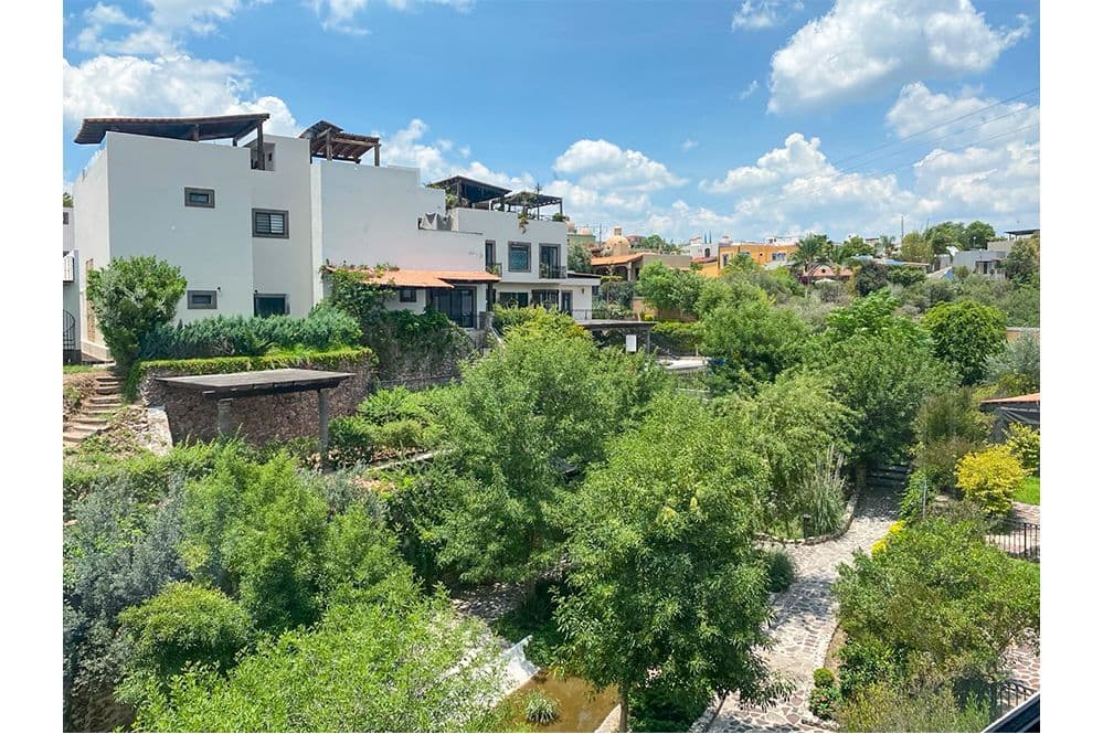 Casa Huerta La Antigua — Antigua Residencial, San Miguel de Allende — photo 55 — lush riverside garden, contemporary architecture