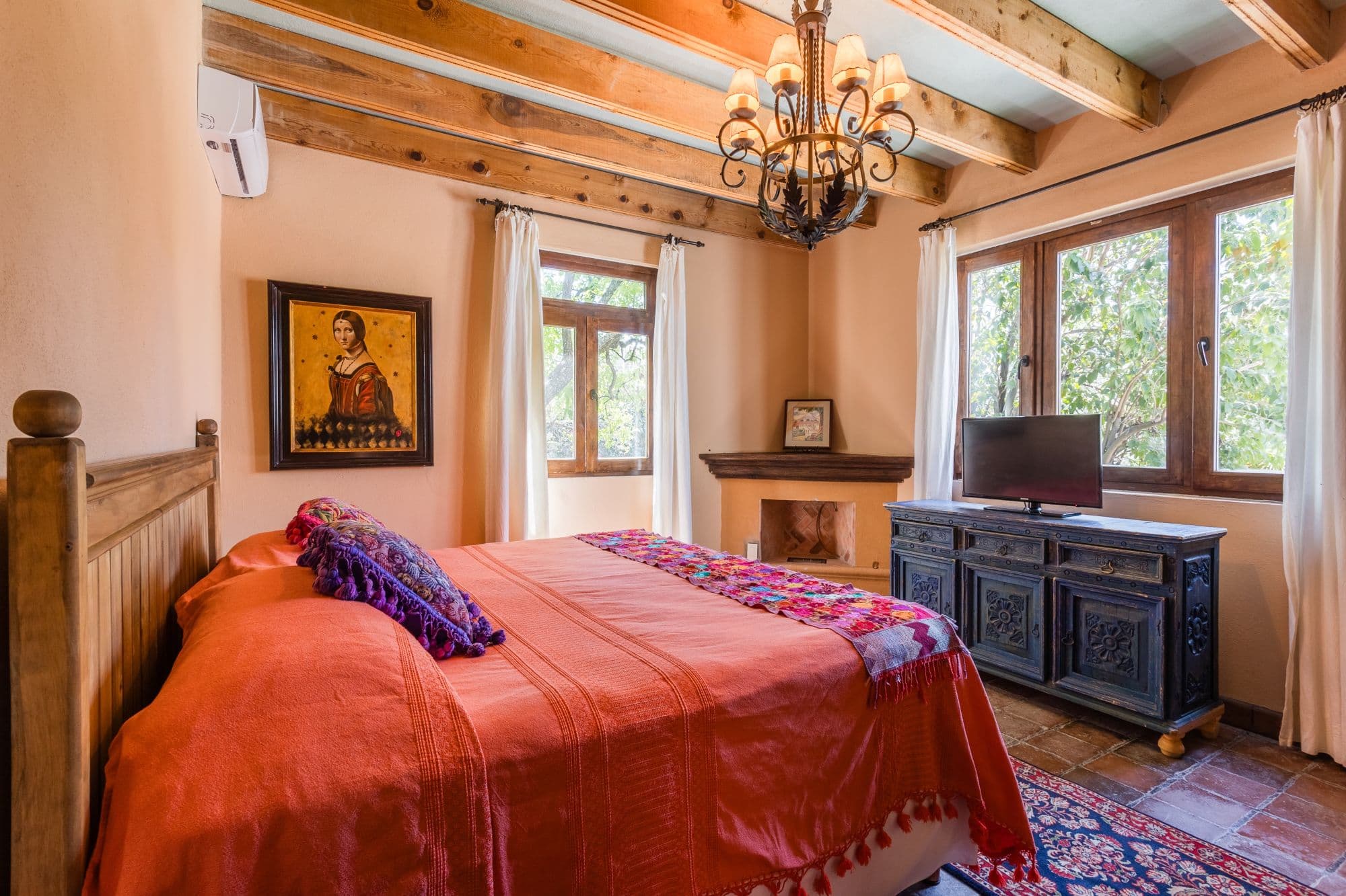 Casa de los Limones — San Antonio, San Miguel de Allende — photo 16 — sunlit master suite, rustic beams, garden views