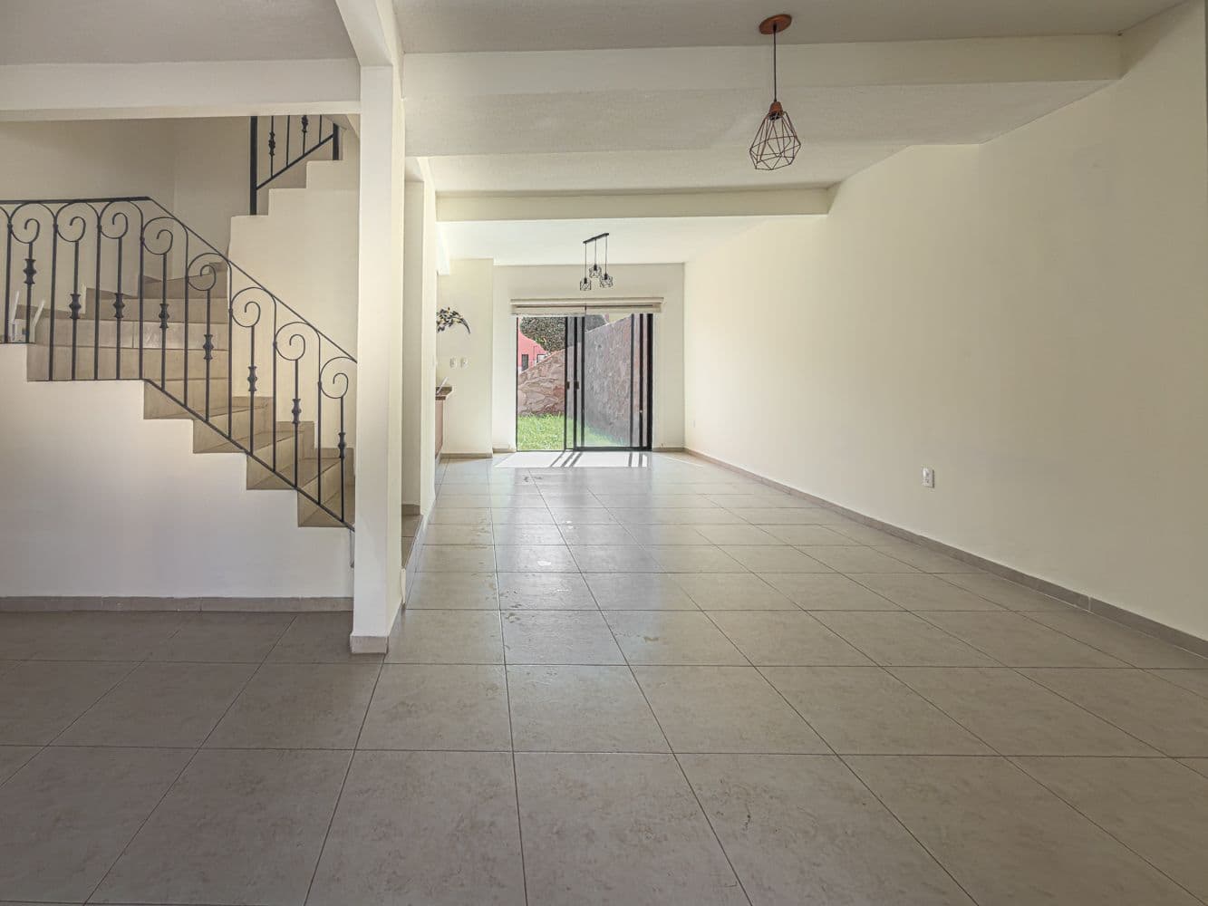 Casa Terracota — Zirándaro, San Miguel de Allende — photo 3 — luminous open living with wrought iron elegance