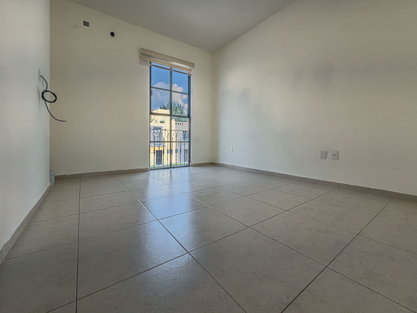 Casa Terracota — Zirándaro, San Miguel de Allende — photo 12 — bright, airy bedroom with scenic views