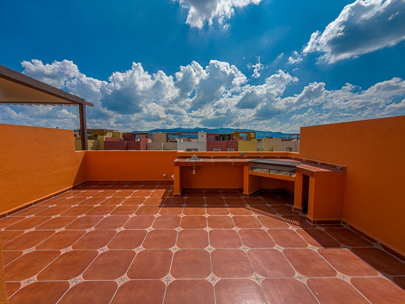 Casa Terracota — Zirándaro, San Miguel de Allende — photo 17 — sky-filled rooftop terrace with mountains