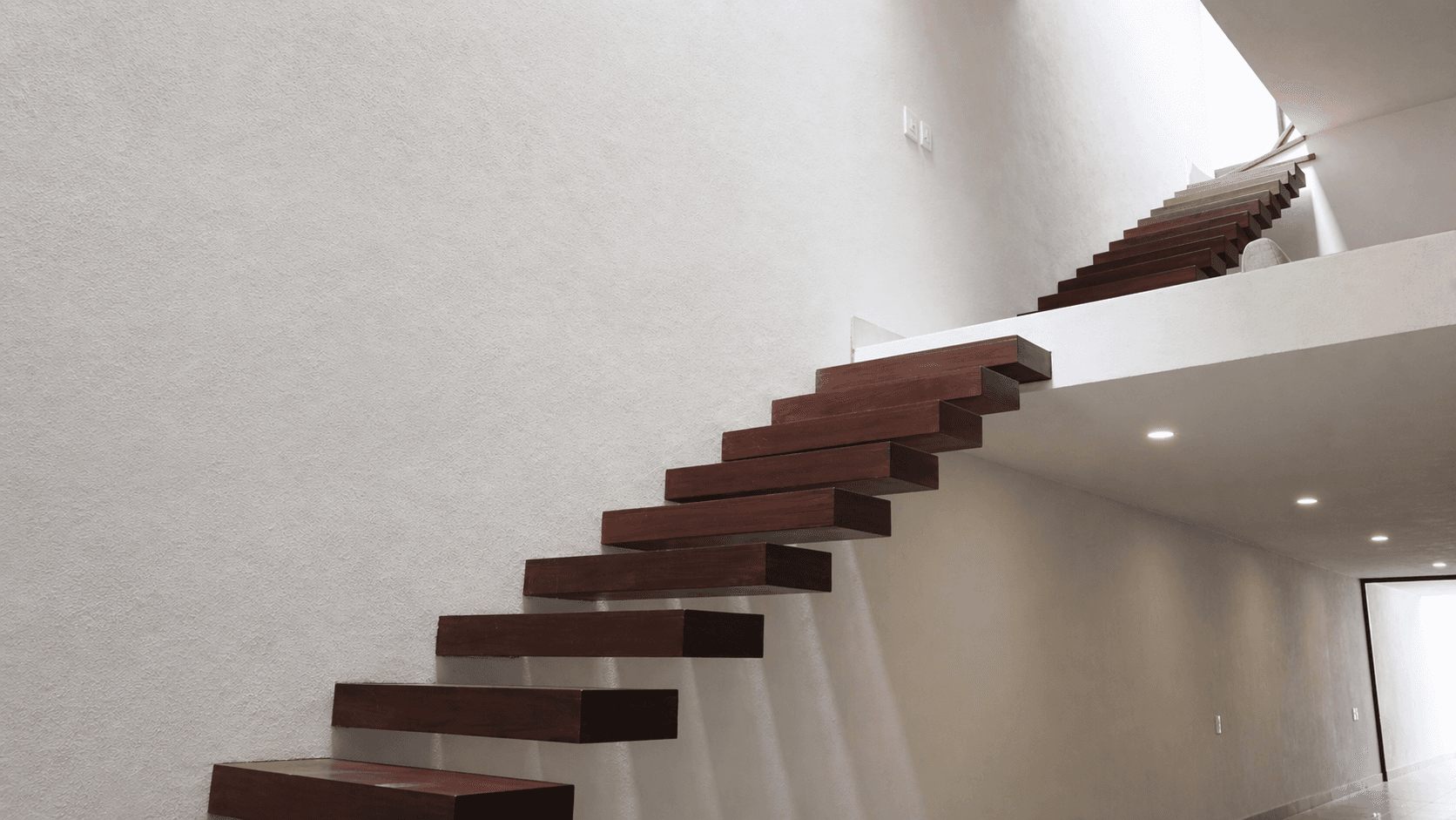 Casa nueva en la Conspiración — Valle del Maíz, San Miguel de Allende — photo 6 — sculptural floating staircase, minimalist elegance
