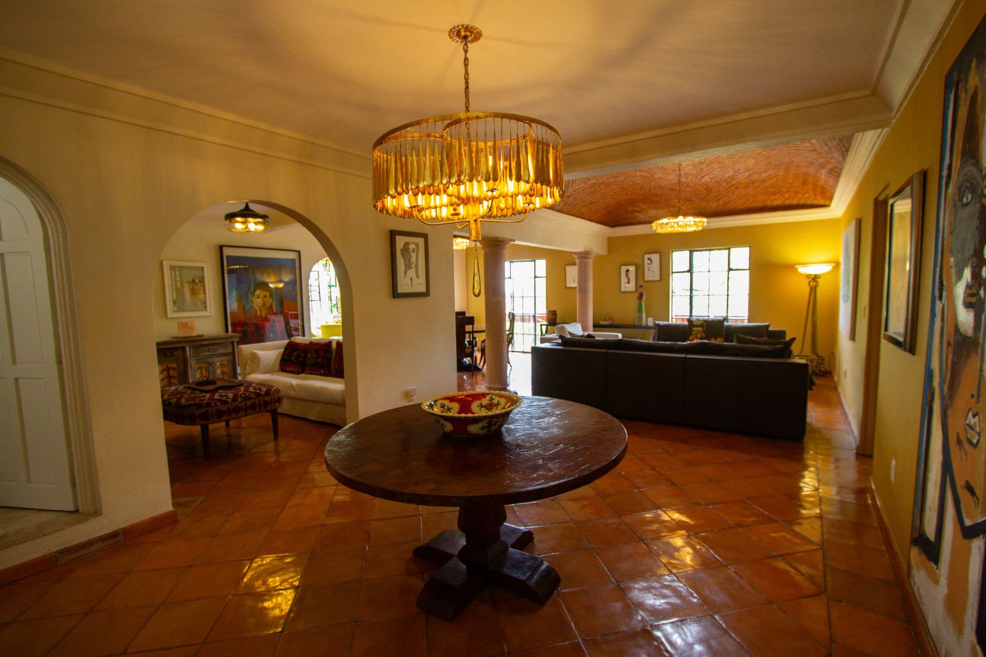 Condo Sto. Domingo — Centro, San Miguel de Allende — photo 3 — golden-hued living room, soaring ceilings