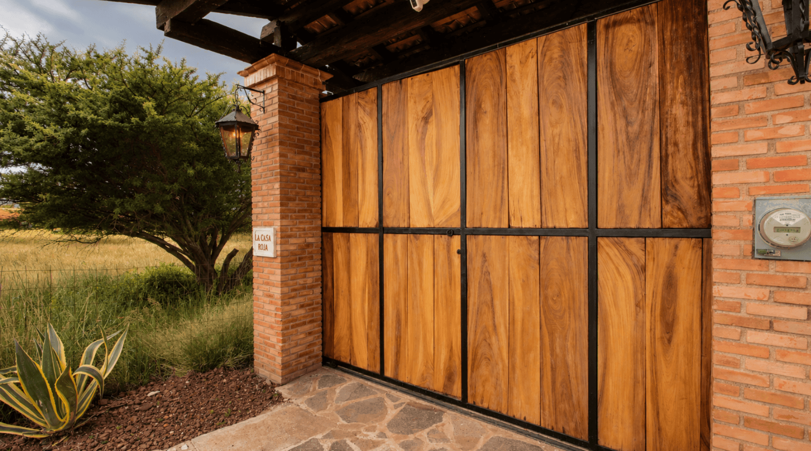 Casa Encantada — Sosnabar, San Miguel de Allende — photo 7 — rustic wooden garage doors, architectural charm