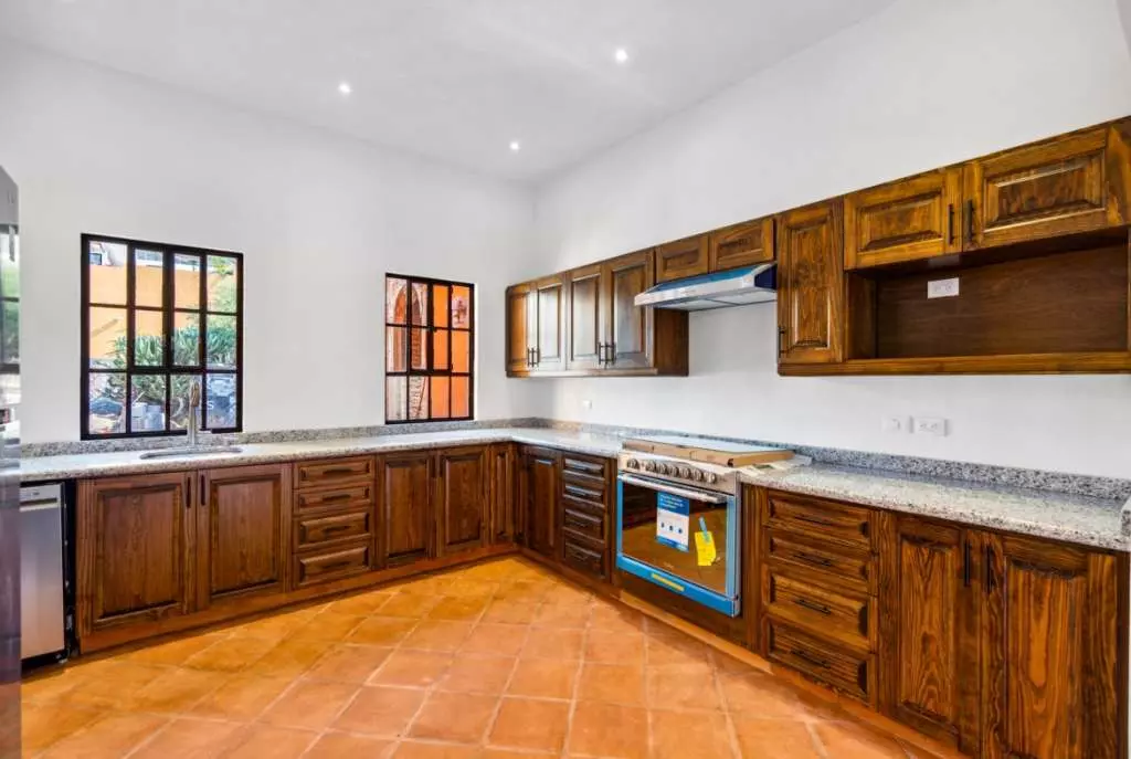 Villa Picasso — Guadiana, San Miguel de Allende — photo 9 — traditional wood cabinetry, terracotta elegance