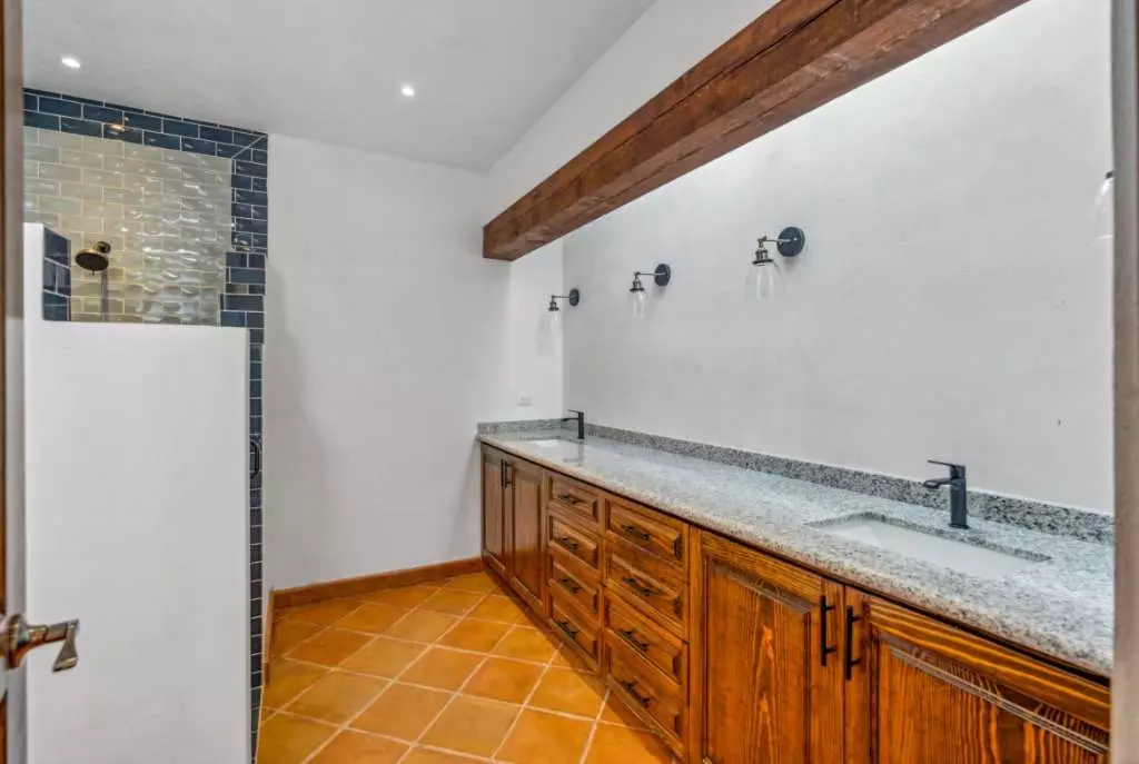 Villa Picasso — Guadiana, San Miguel de Allende — photo 12 — rustic-elegant dual vanity bathroom