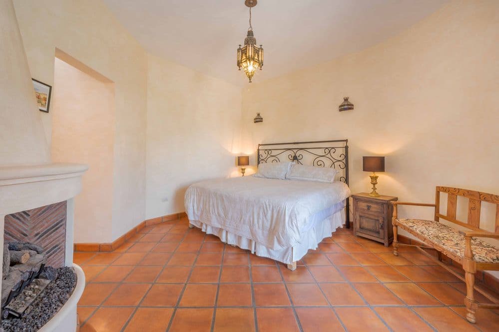 Casa Tranquila — San Antonio, San Miguel de Allende — photo 16 — luminous colonial bedroom, rustic elegance
