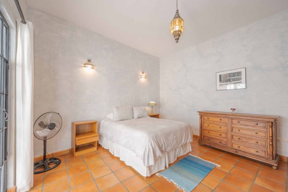 Casa Tranquila — San Antonio, San Miguel de Allende — photo 19 — serene bedroom with authentic terracotta floors