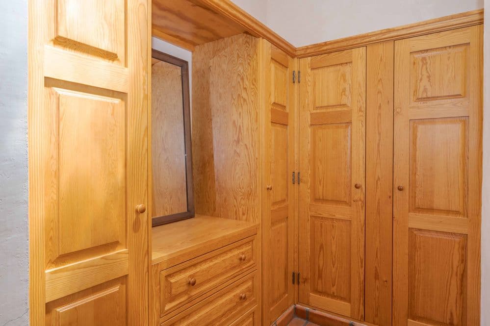 Casa Tranquila — San Antonio, San Miguel de Allende — photo 18 — warm wooden dressing room elegance