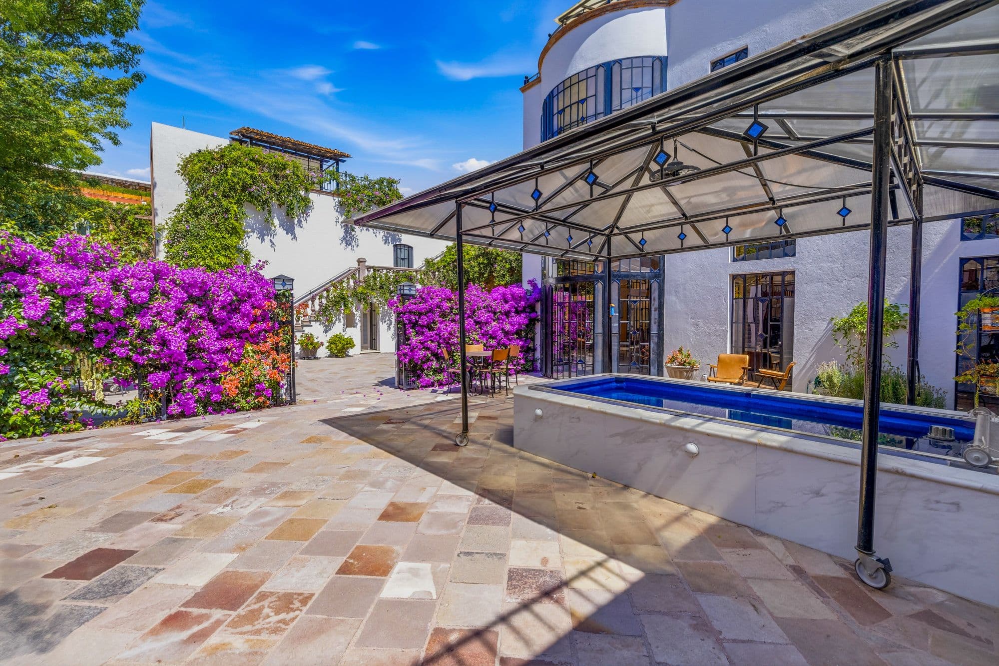 Casa Grande — Guadiana, San Miguel de Allende — photo 13 — luminous courtyard, vibrant bougainvillea splendor