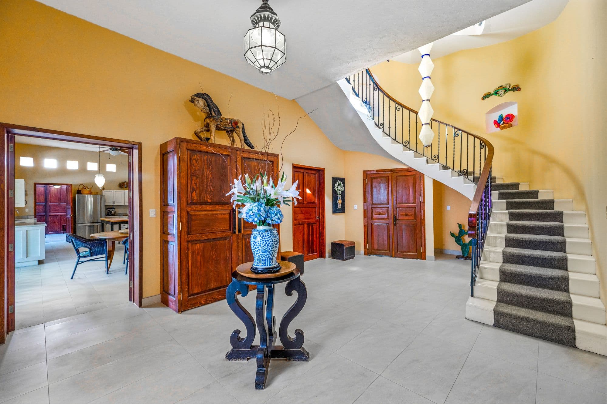 Casa Grande — Guadiana, San Miguel de Allende — photo 2 — luminous foyer, soaring curved staircase